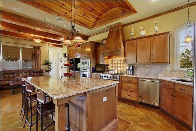 Craftsman Kitchen with Pendant light, limestone tile floors, Arched window, Flush, MS International Granite Golden Moon