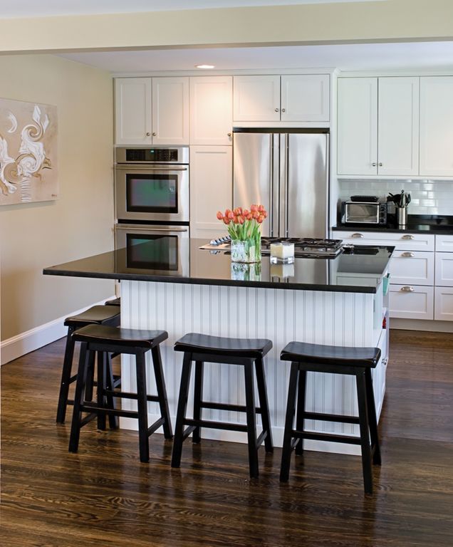Cottage Kitchen with Subway Tile, Built In Refrigerator, electric cooktop, Soapstone counters, Target Scoop Stool Black