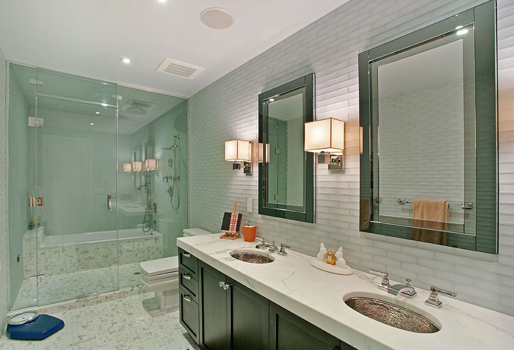 Contemporary Master Bathroom with Shower, Rain shower, frameless showerdoor, Standard height, penny tile floors, Flush