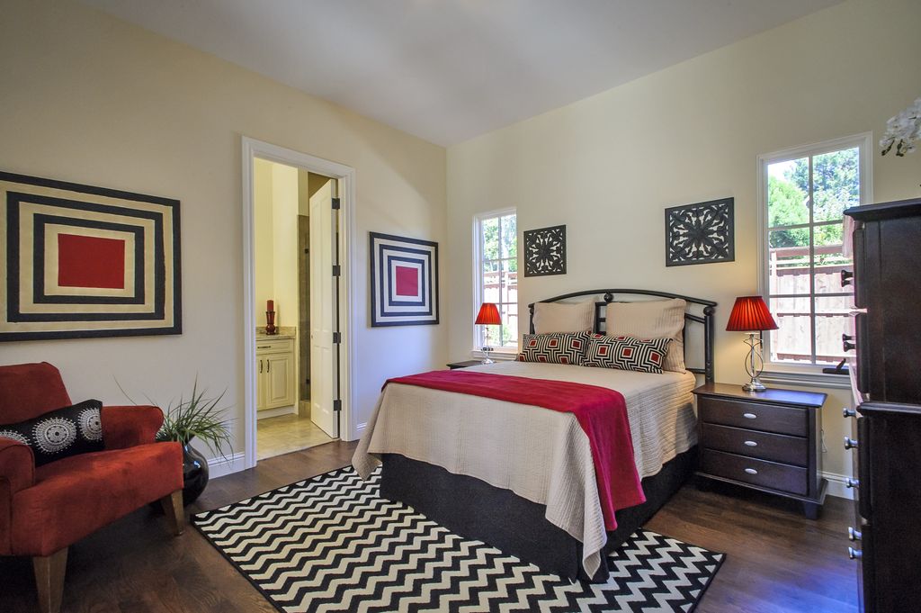 Contemporary Guest Bedroom with Casement, Hardwood floors, Crown molding, Standard height, six panel door, Carpet