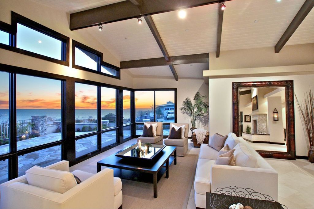Contemporary Living Room with Hyde Sofa, Hyde Chair, Track lighting, Exposed beam, Paint, stone tile floors, specialty window