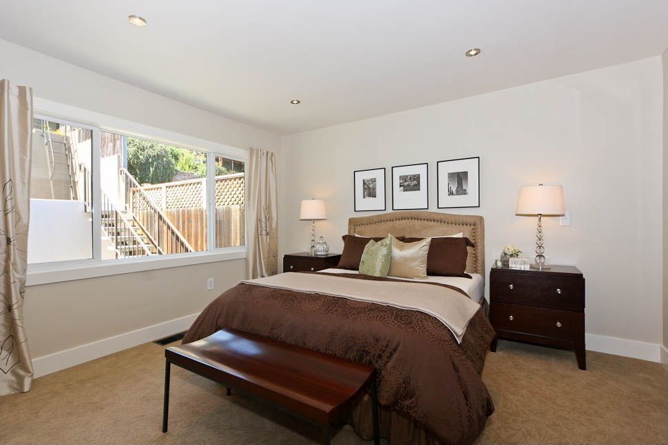 Contemporary Guest Bedroom with Standard height, specialty window, Carpet, can lights