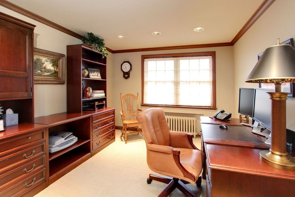 Traditional Home Office with can lights, Crown molding, double-hung window, Carpet, Built-in bookshelf, Standard height