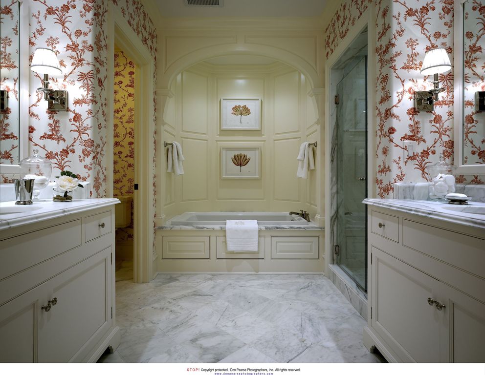 Traditional Master Bathroom with Complex marble counters, frameless showerdoor, Wall sconce, Complex Marble, drop in bathtub