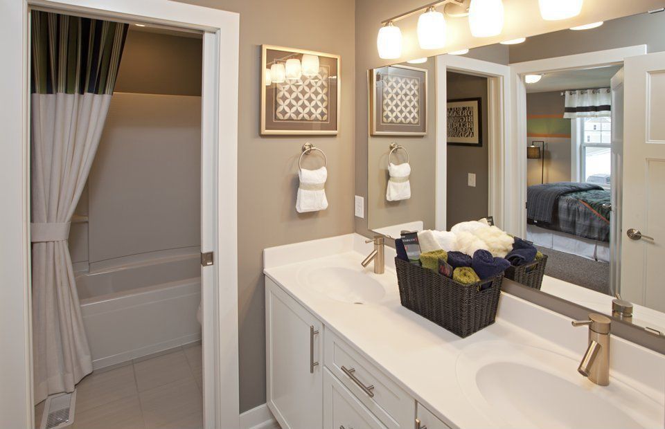 Traditional Master Bathroom with stone tile floors, Flat panel cabinets, Double sink, Undermount sink, partial backsplash