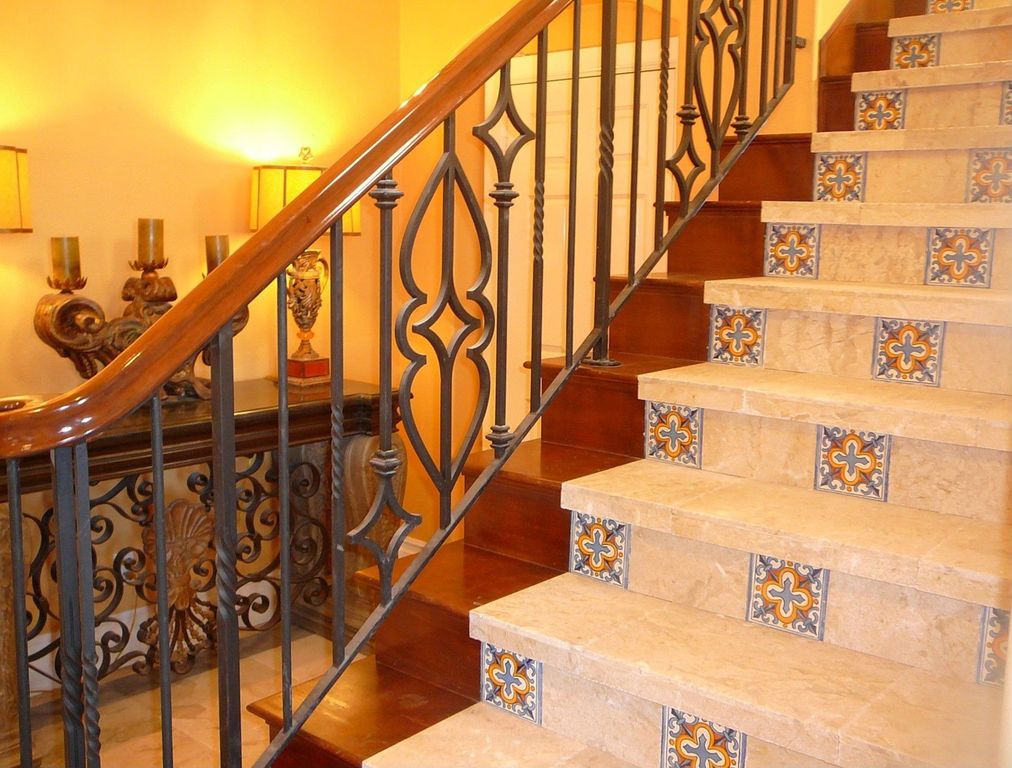 Eclectic Staircase with Hardwood floors, terracotta tile floors, curved staircase, High ceiling