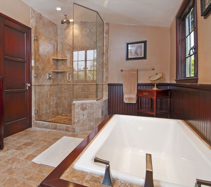 Craftsman Master Bathroom with stone tile floors, Paint, frameless showerdoor, Wainscotting, Casement, can lights, Bathtub