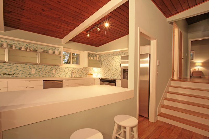 Contemporary Kitchen with Exposed beam, flush light, dishwasher, Standard height, Glass panel, Paint, Hardwood floors, Flush