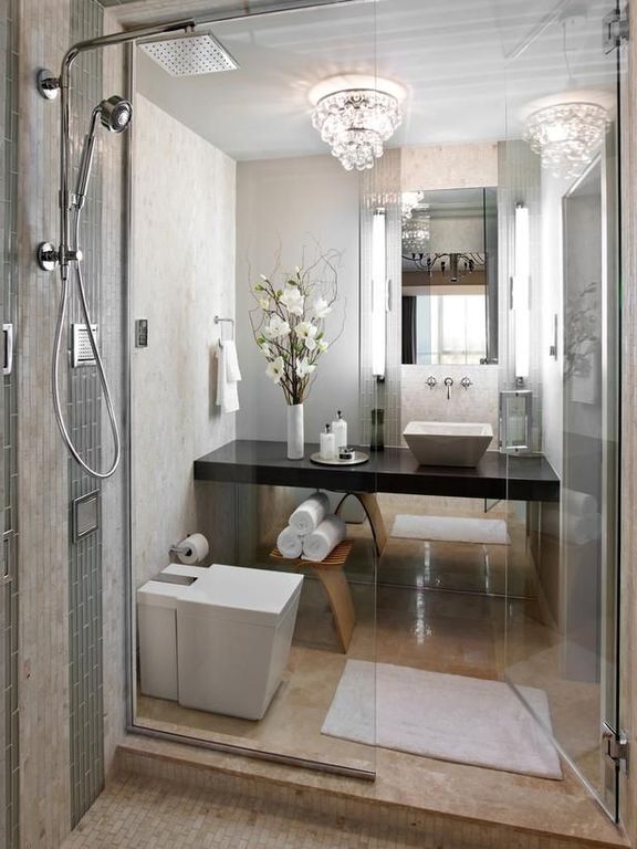 Contemporary 3/4 Bathroom with frameless showerdoor, Handheld showerhead, Scabos travertine tumbled mosaic, Wall sconce