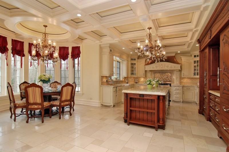 Traditional Kitchen with full backsplash, limestone tile floors, dishwasher, Chandelier, can lights, Complex marble counters
