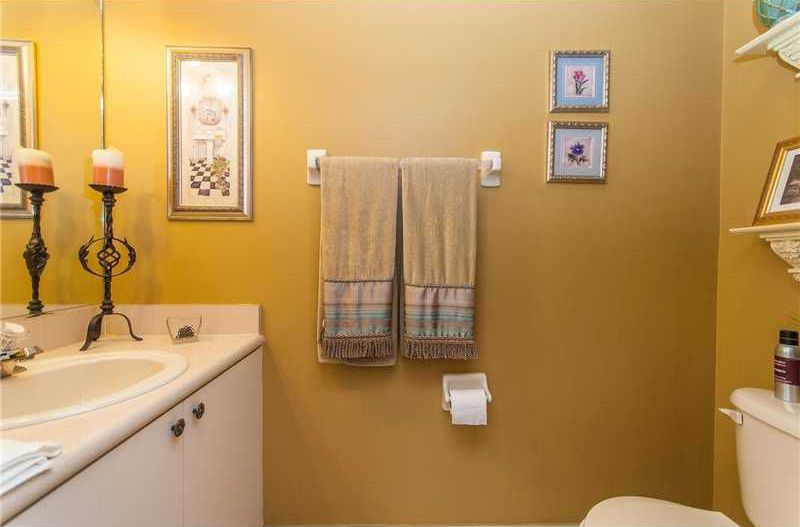 Traditional Powder Room with Limestone counters, full backsplash, Limestone, Drop-in sink, Paint, Powder room, Flush