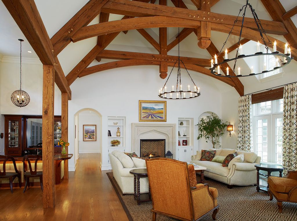 Mediterranean Living Room with Cathedral ceiling, Fireplace, Exposed beam, Currey and company simpatico orb chandelier-4l