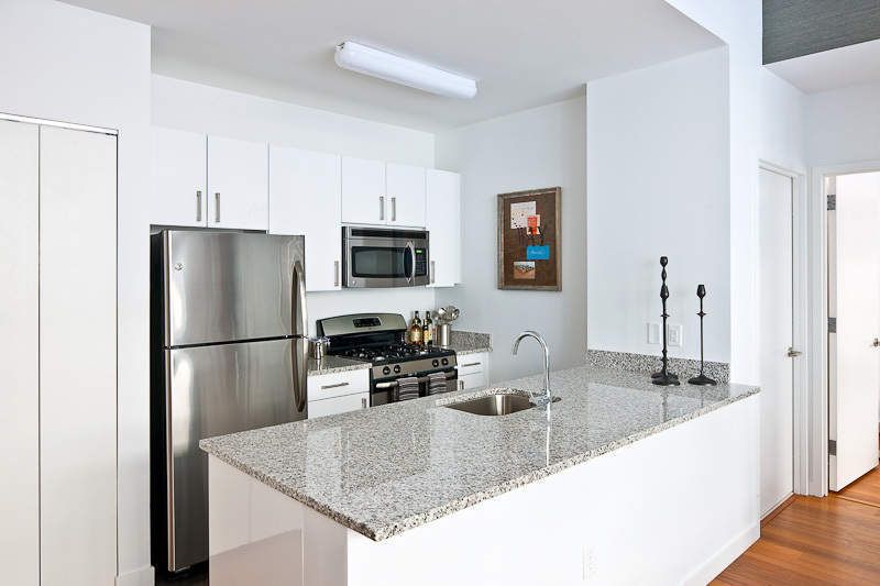 Contemporary Kitchen with European Cabinets, High ceiling, Simple Granite, Freestanding Full Size Top Freezer Refrigerator