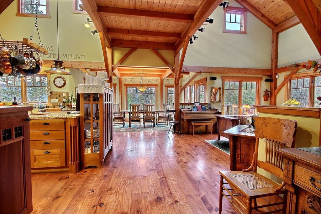 Craftsman Great Room with Wood panel ceiling, High ceiling, Hardwood floors, flush light, Loft, Pendant light, Area rug