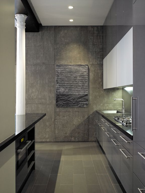 Contemporary Kitchen with wall oven, slate tile floors, European Cabinets, Standard height, full backsplash, electric cooktop