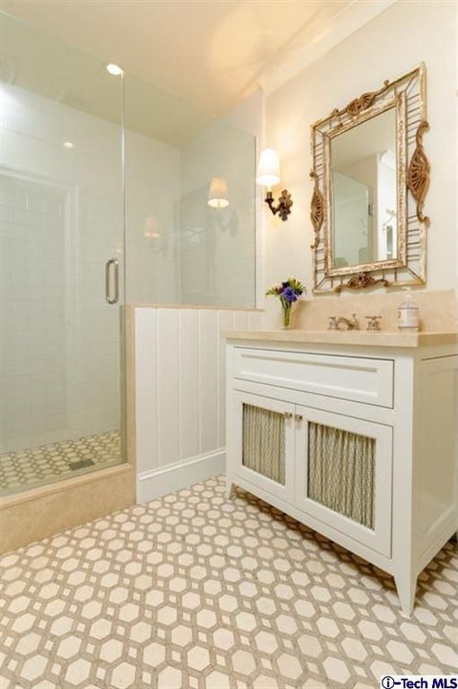 Traditional 3/4 Bathroom with penny tile floors, partial backsplash, Shower, Limestone, Standard height, Flat panel cabinets