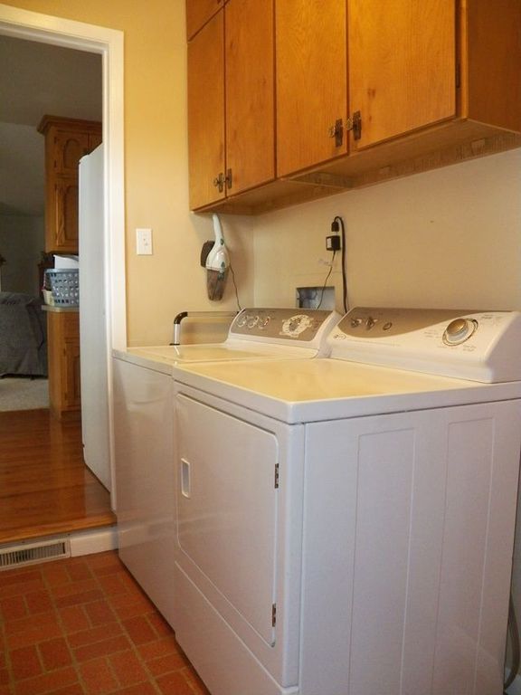 Traditional Laundry Room with Standard height, laundry sink, Built-in bookshelf, Brick floors, Drop-in sink