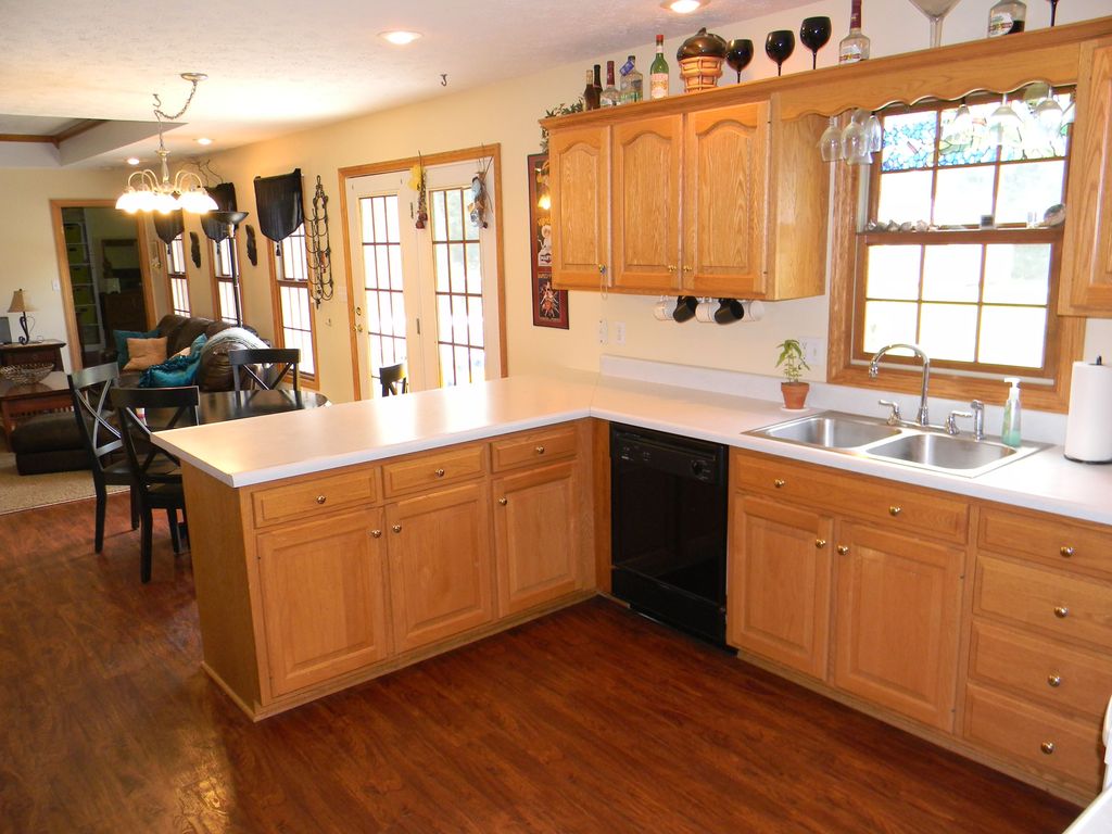 Craftsman Kitchen with Multiple Sinks, French doors, Pendant light, Standard height, Wall sconce, Raised panel, dishwasher
