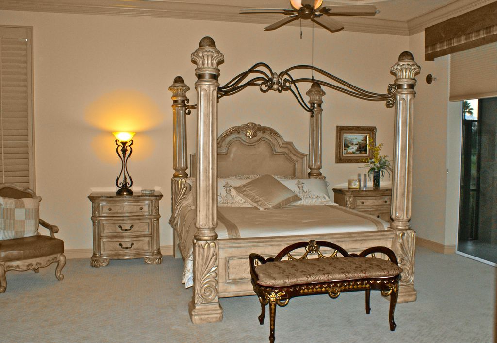 Mediterranean Master Bedroom with Standard height, Ceiling fan, Carpet, Crown molding