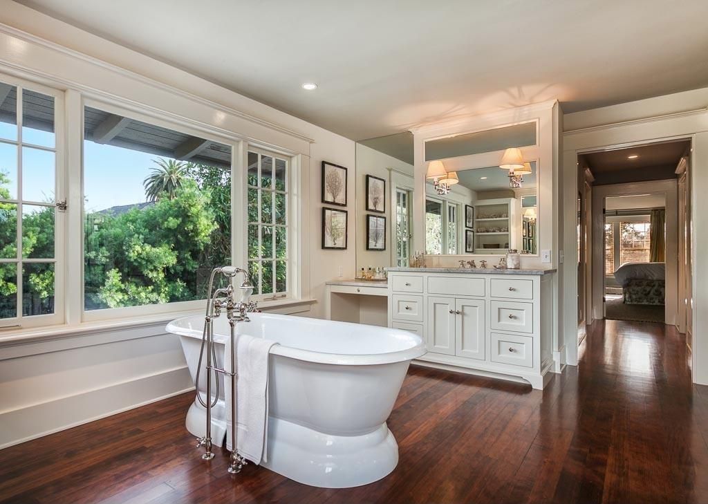 Traditional Master Bathroom with picture window, Freestanding, Inset cabinets, Hardwood floors, Standard height, Casement