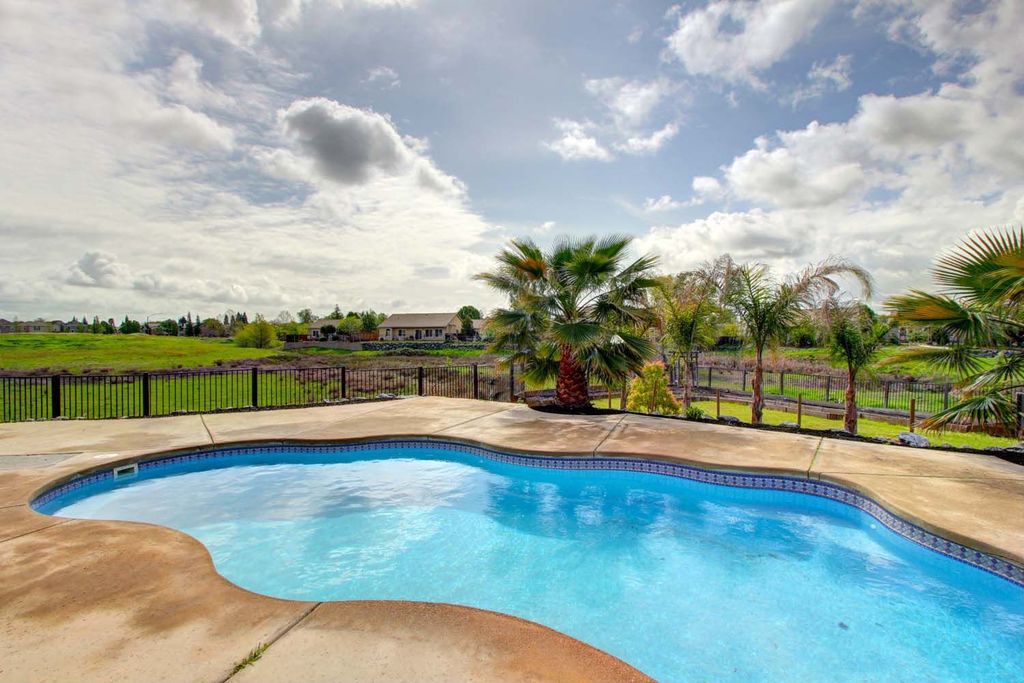 Mediterranean Swimming Pool with Fence, Other Pool Type, exterior concrete tile floors, exterior tile floors