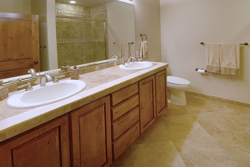 Craftsman Full Bathroom with Stone Tile, Inset cabinets, Limestone tile counters, Raised panel, Standard height, Drop-in sink