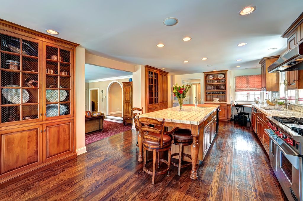 Craftsman Kitchen with Wall Hood, Raised panel, Undermount sink, double oven range, stone tile counters, Limestone Tile