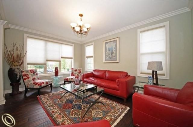Traditional Living Room with Large floor vase, Standard height, Oriental area rug, Traditional five uplight chandelier, Paint