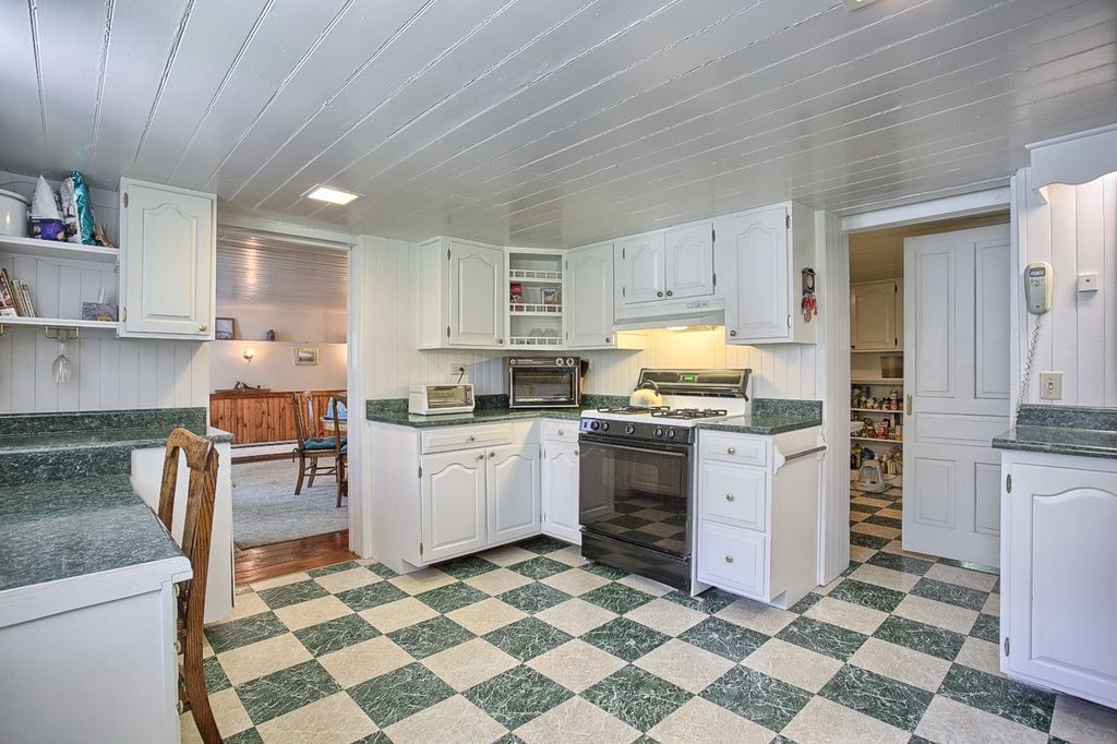 Cottage Kitchen with Standard height, U-shaped, Halo 3 in. recessed square baffle trim, Simple granite counters, Custom hood