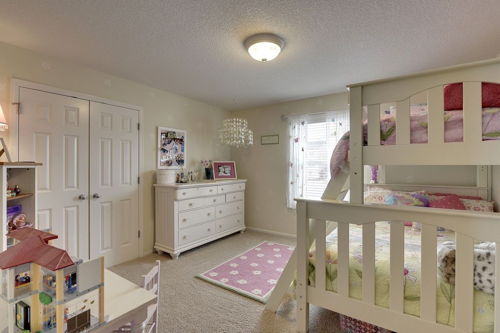 Traditional Kids Bedroom with Standard height, flush light, Carpet, Chandelier, no bedroom feature, Built-in bookshelf