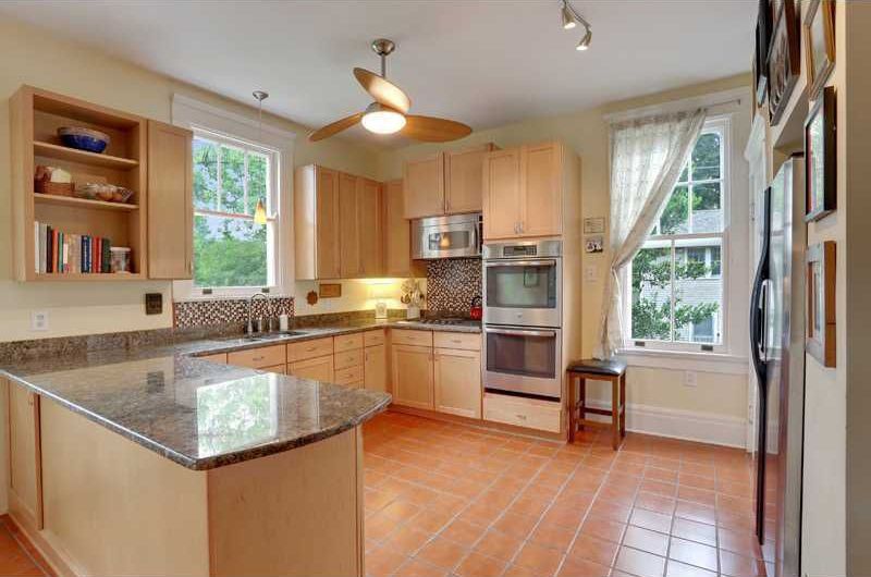 Contemporary Kitchen with European Cabinets, built-in microwave, Paint 1, Standard height, Complex granite counters, Flush