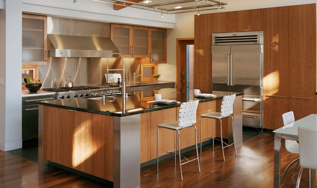 Contemporary Kitchen with 3 in. Granite Countertop in Absolute Black, Breakfast nook, Built In Refrigerator, can lights