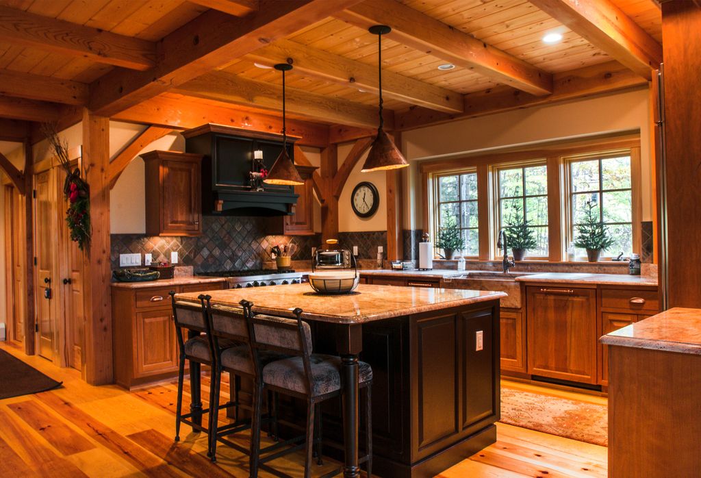 Country Kitchen with Pendant light, Copper cone pendant light, Exposed beam, can lights, Farmhouse sink, gas range, Casement