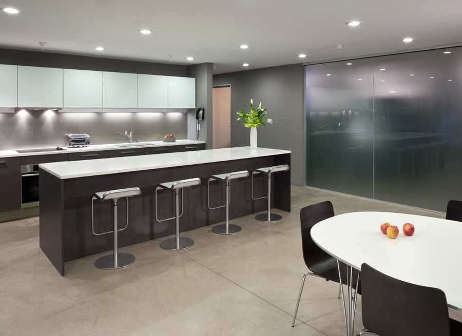 Contemporary Kitchen with wall oven, electric cooktop, can lights, Kitchen island, Corian counters, European Cabinets, Flush