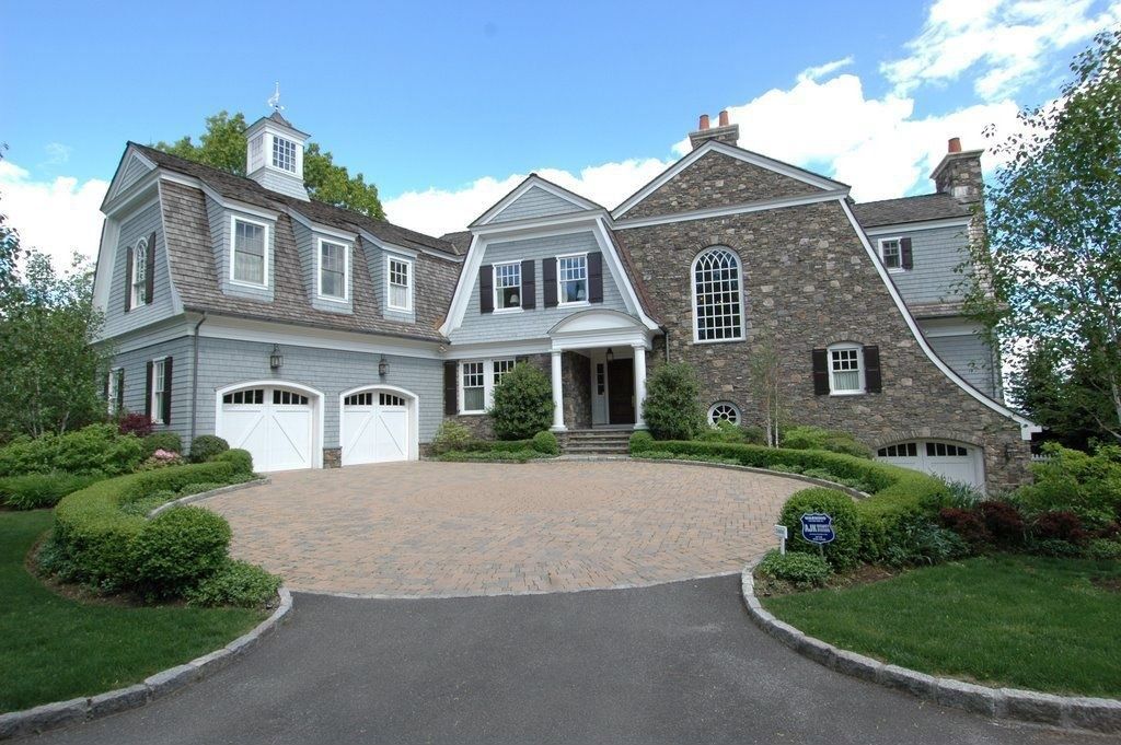 Traditional Front of Home with Barn door, exterior brick floors, Casement, Arched window, double-hung window, six panel door