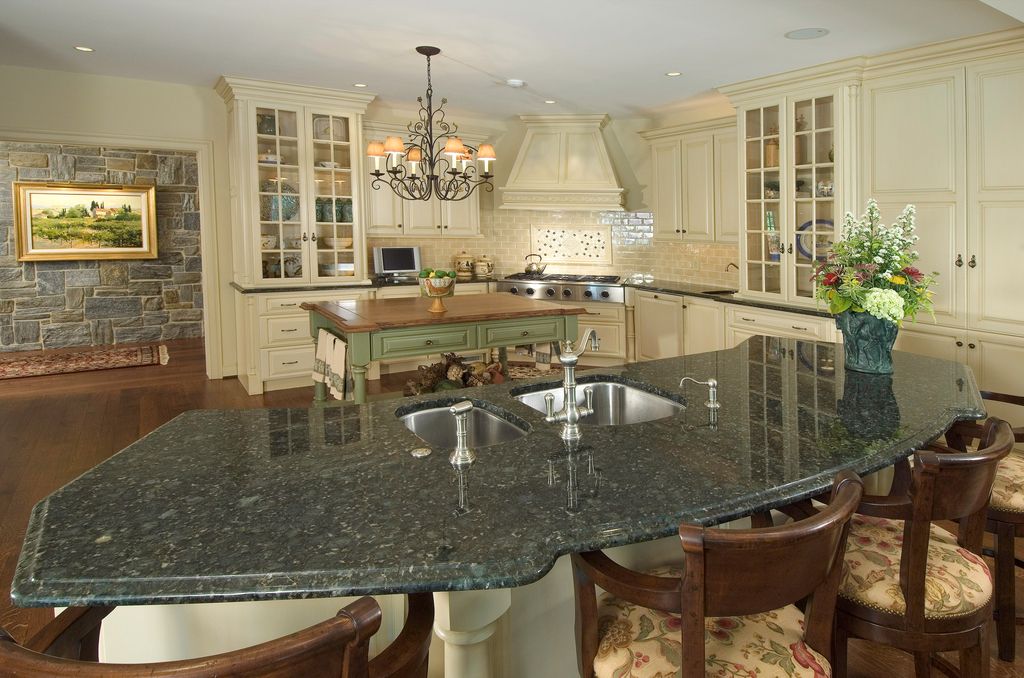 Country Kitchen with Raised panel, Kitchen island, electric cooktop, Chandelier, Standard height, Multiple Sinks, can lights