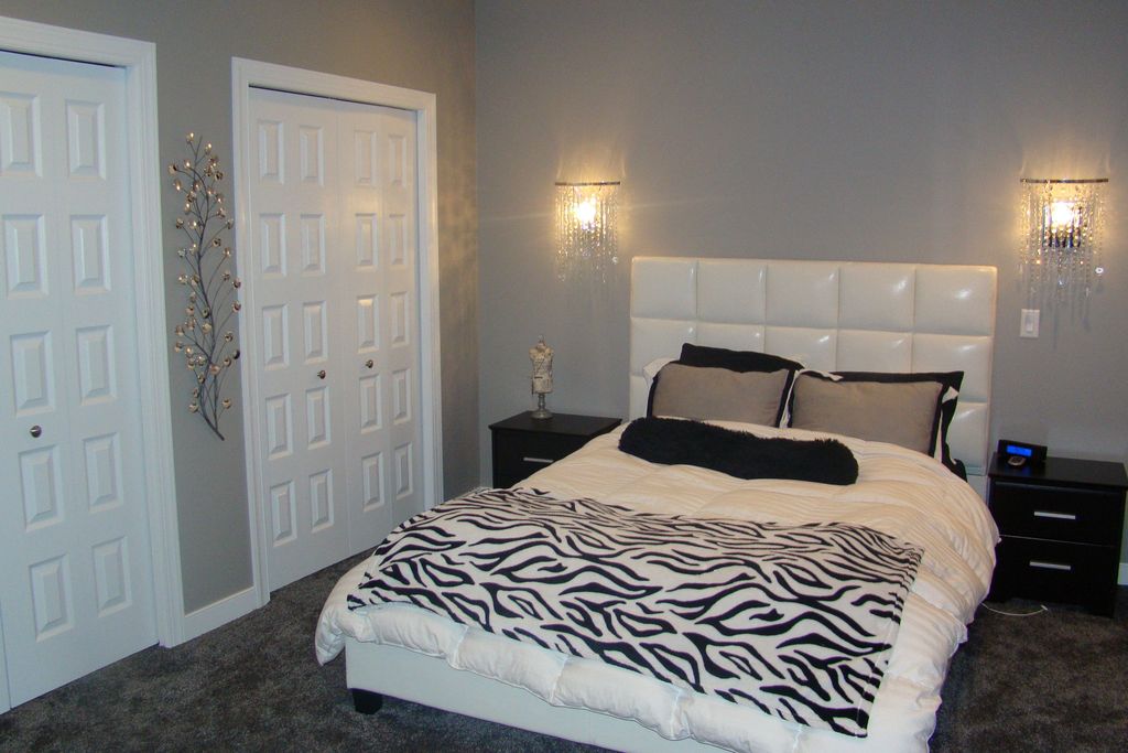 Eclectic Master Bedroom with Wall sconce, Standard height, Built-in bookshelf, Carpet