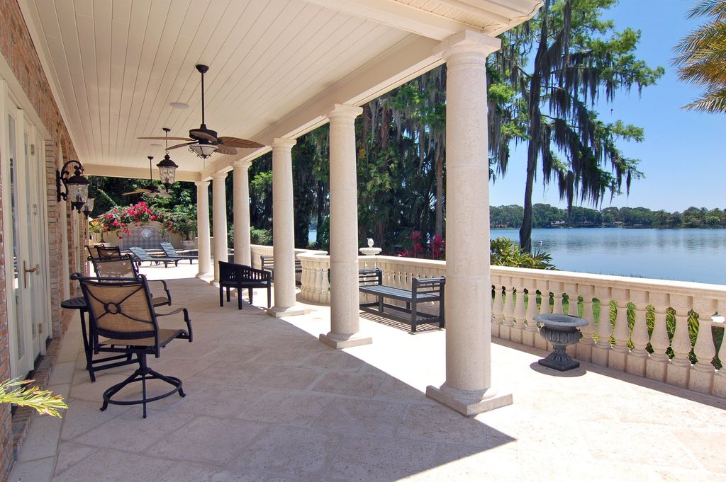 Traditional Porch with exterior tile floors, Newport outdoor swivel chair, Wrap around porch, exterior concrete tile floors