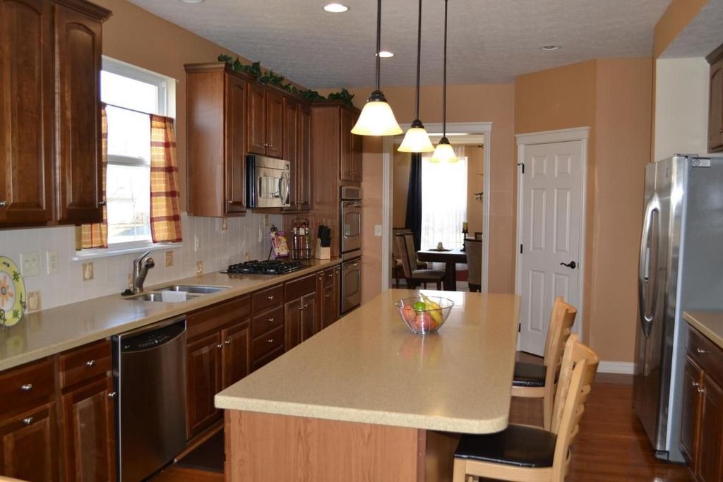 Craftsman Kitchen with Raised panel, Paint 1, built-in microwave, Sea Gull Lighting Bronze Finish Mini Pendant, U-shaped