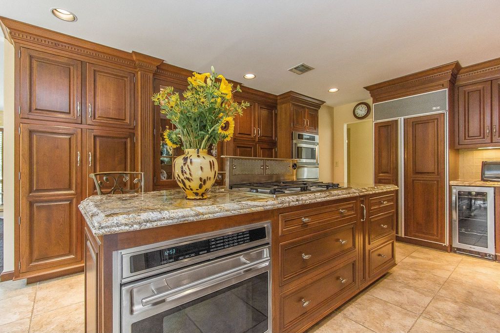 Craftsman Kitchen with Inset cabinets, Built-in microwave drawer, Standard height, Wine refrigerator, stone tile floors