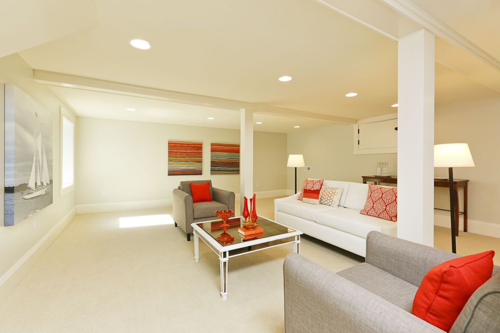 Contemporary Living Room with Exposed beam, Carpet, Built-in bookshelf, Casement, can lights, Standard height, Columns