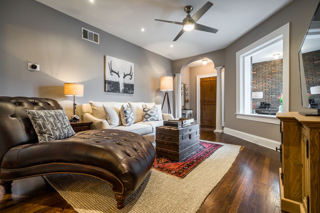 Traditional Living Room with flush light, Hardwood floors, Columns, Caden Leather Chaise, High ceiling, Ceiling fan, Carpet